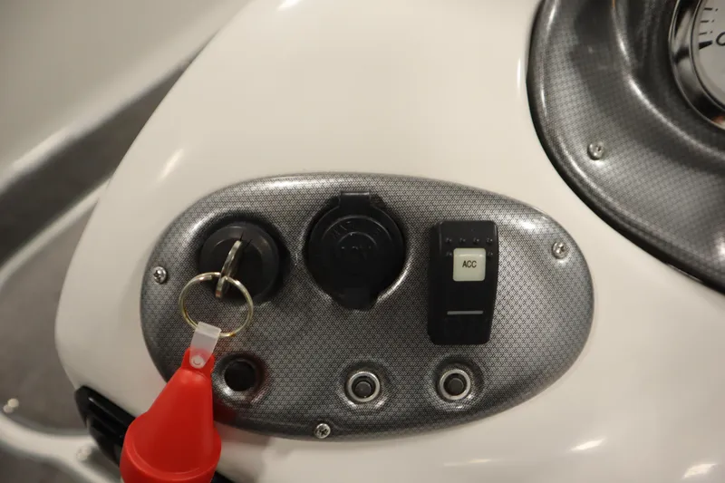 Slide: The Image of Control panel of a 2015 Starcraft 1915 OB Limited boat with key and ACC switch. - 25
