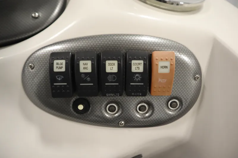 Slide: The Image of Control panel of a 2015 Starcraft 1915 OB Limited boat with labeled switches. - 26