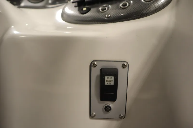 Slide: The Image of Switch panel for cup holder lights on 2015 Starcraft 1915 OB Limited boat. - 27