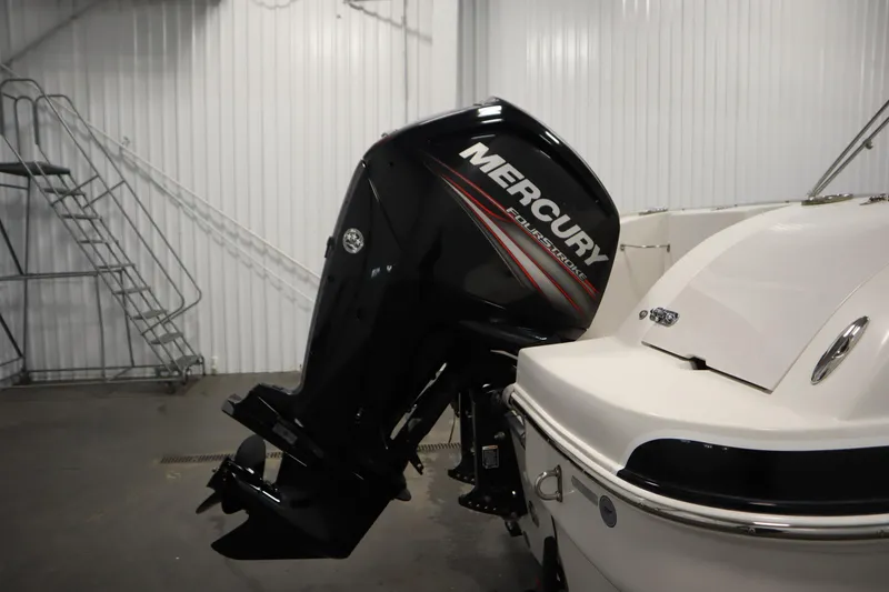 Slide: The Image of 2015 Starcraft 1915 OB Limited boat with Mercury FourStroke outboard motor in a storage facility. - 36