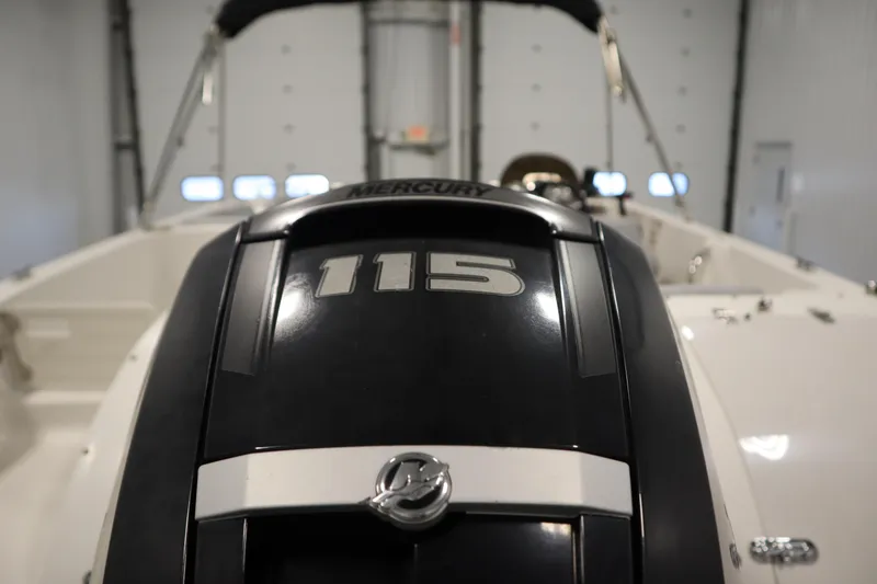 Slide: The Image of 2015 Starcraft 1915 OB Limited boat with Mercury 115 engine in indoor setting. - 38