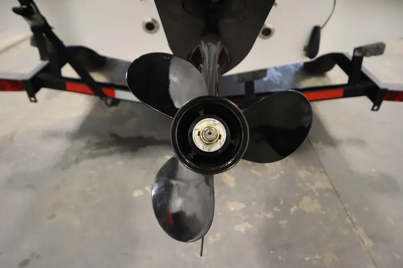 Slide: The Image of 2015 Starcraft 1915 OB Limited boat propeller close-up in a garage setting. - 39