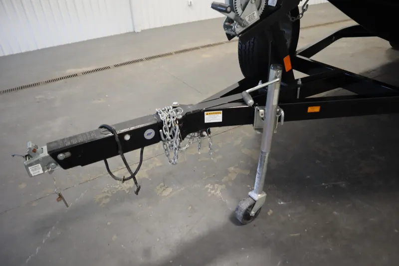 Slide: The Image of Trailer hitch of a 2015 Starcraft 1915 OB Limited boat, featuring chains and a wheel jack. - 40