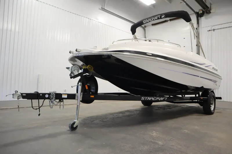 Slide: The Image of 2015 Starcraft 1915 OB Limited boat on trailer in indoor storage. - 42