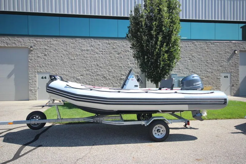Slide: The Image of Zodiac Open 4.8 NEO 70hp boat on trailer, year 2026. - 4