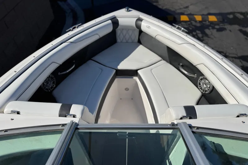 Slide: The Image of 2019 Regal 2100 boat interior with white seating and modern design. - 12