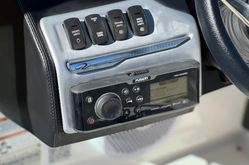 Slide: The Image of Control panel of a 2019 Regal 2100 boat with Fusion audio system. - 24