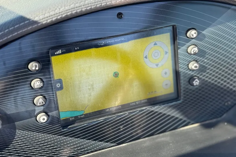 Slide: The Image of 2019 Regal 2100 dashboard with GPS navigation display and control buttons. - 26