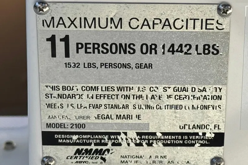 Slide: The Image of 2019 Regal 2100 capacity plate: 11 persons or 1442 lbs, compliant with safety standards. - 28