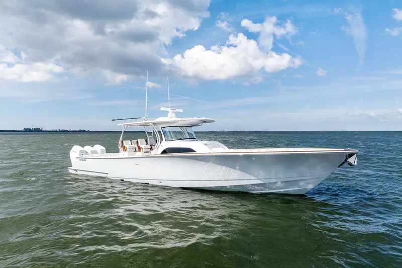 The Image of 2026 Valhalla Boatworks V-46 cruising on open water under a partly cloudy sky. - 1