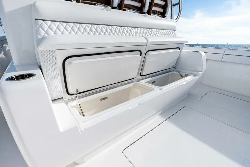 Slide: The Image of 2026 Valhalla Boatworks V-46 deck with open storage compartments, ocean view. - 38