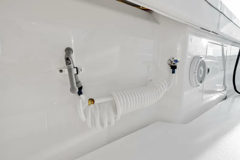 Slide: The Image of 2026 Valhalla Boatworks V-46 deck with coiled hose and speaker detail. - 39