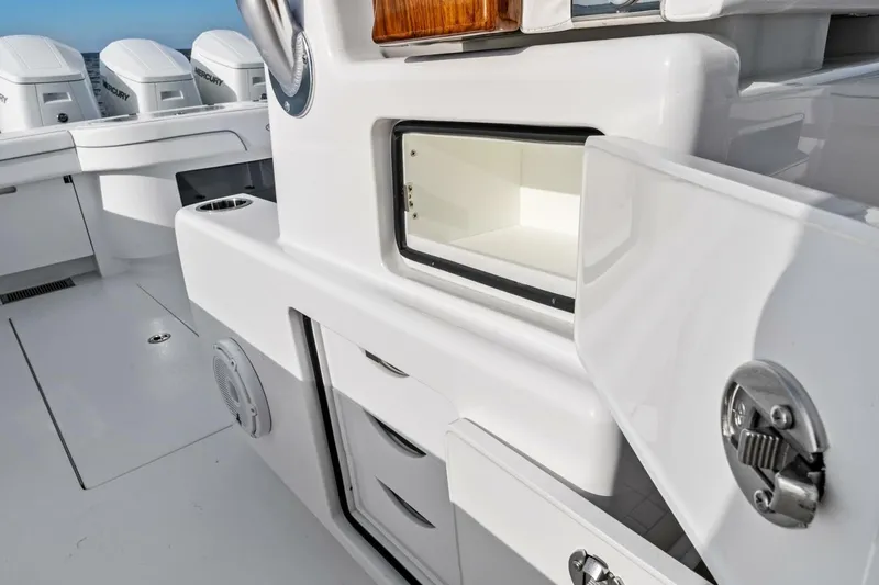 Slide: The Image of 2026 Valhalla Boatworks V-46 interior with storage compartments and Mercury engines. - 45