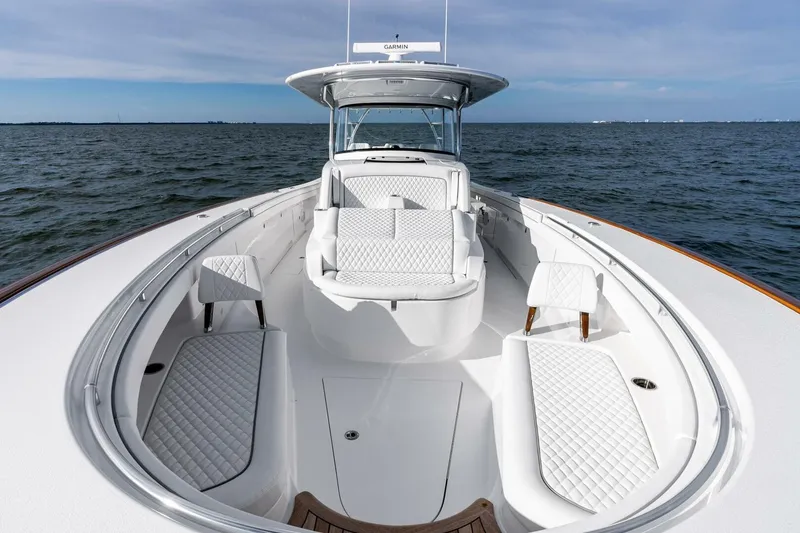Slide: The Image of 2026 Valhalla Boatworks V-46 luxury boat interior with white seating on open water. - 53