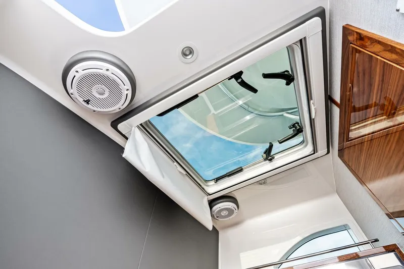 Slide: The Image of 2026 Valhalla Boatworks V-46 interior with skylight and speaker system. - 60