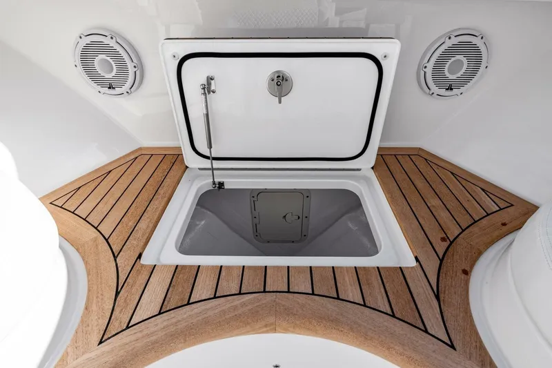 Slide: The Image of 2026 Valhalla Boatworks V-46 deck hatch with teak flooring and speakers. - 61