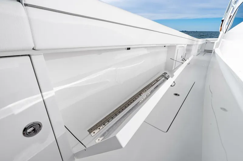 Slide: The Image of 2026 Valhalla Boatworks V-46 interior detail, showcasing sleek white storage compartment. - 62