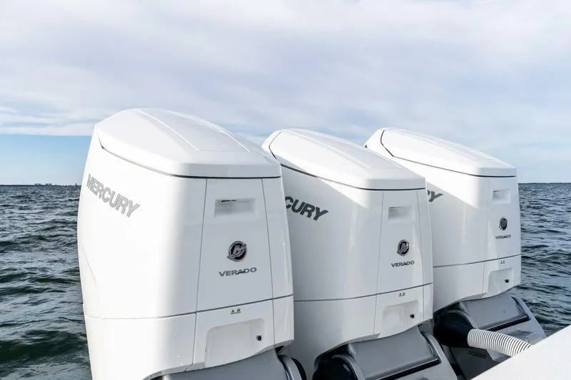 Slide: The Image of Triple Mercury Verado outboard engines on 2026 Valhalla Boatworks V-46, ocean backdrop. - 66