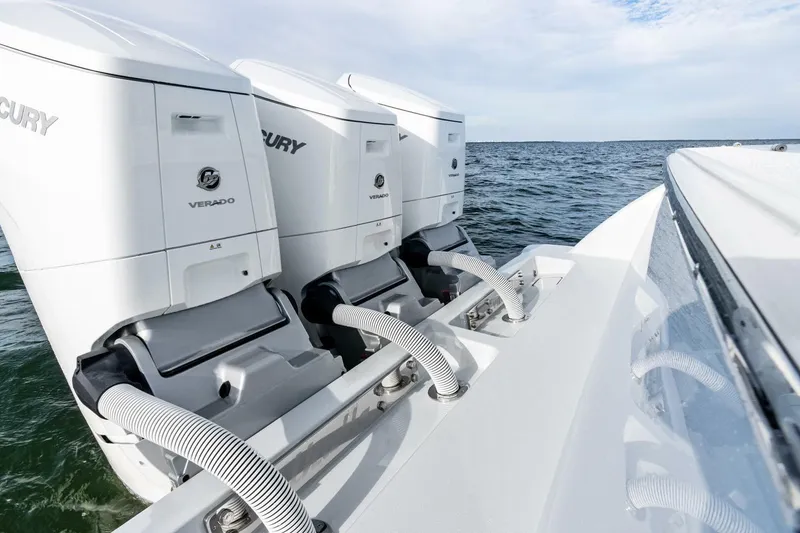 Slide: The Image of 2026 Valhalla Boatworks V-46 with triple Mercury Verado engines on open water. - 67