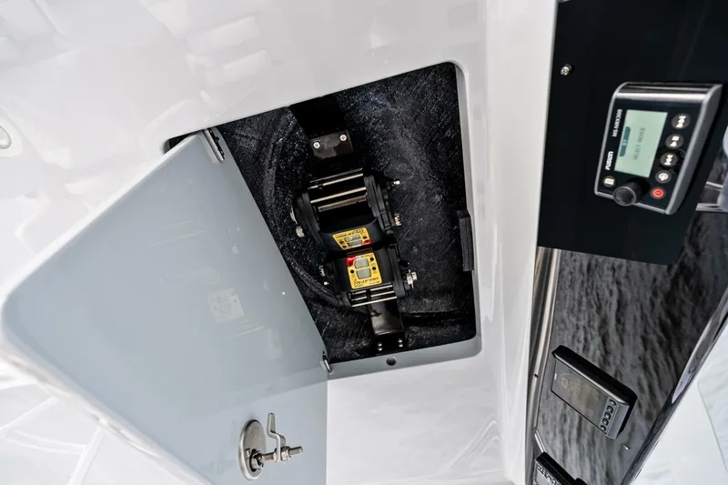 Slide: The Image of 2026 Valhalla Boatworks V-46 interior compartment with control panel and equipment. - 68