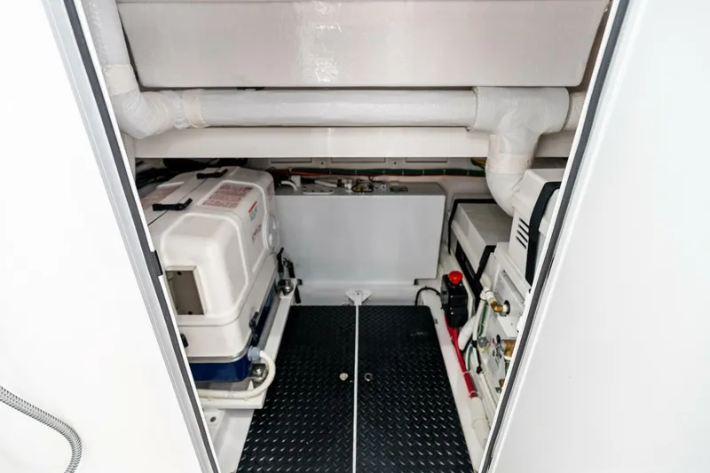 Slide: The Image of Engine room of 2026 Valhalla Boatworks V-46, showcasing equipment and piping. - 73