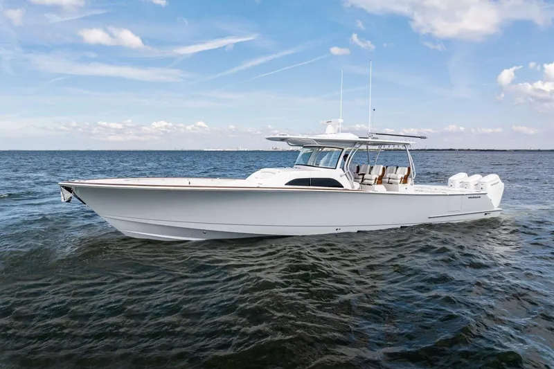 Slide: The Image of 2026 Valhalla Boatworks V-46 cruising on open water under a clear sky. - 75