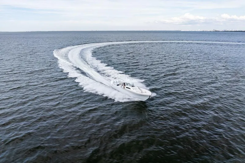 Slide: The Image of 2026 Valhalla Boatworks V-46 cruising swiftly on open water, creating a dynamic wake. - 80