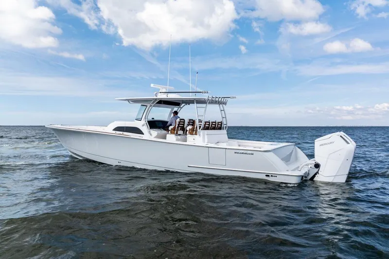 Slide: The Image of 2026 Valhalla Boatworks V-46 cruising on open water under a clear sky. - 84