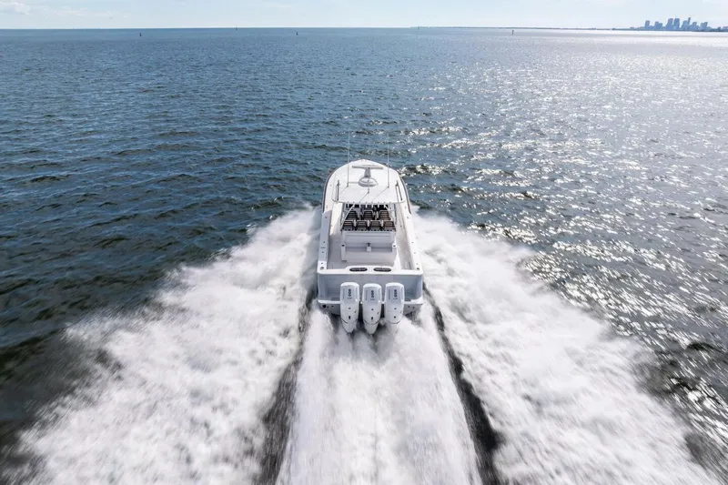Slide: The Image of 2026 Valhalla Boatworks V-46 cruising on open water, showcasing powerful engines and sleek design. - 85