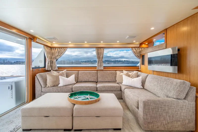 Slide: The Image of Luxurious interior of 1995 Tollycraft 57 Walk Around Pilothouse yacht with plush seating and scenic views. - 13