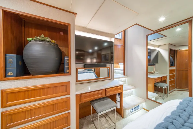 Slide: The Image of Luxurious interior of 1995 Tollycraft 57 Walk Around Pilothouse with elegant wood cabinetry. - 25