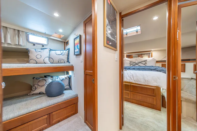 Slide: The Image of Interior of 1995 Tollycraft 57 Walk Around Pilothouse with cozy bunk beds and bedroom. - 30