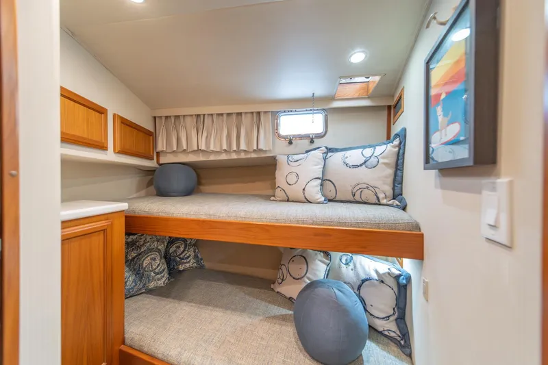Slide: The Image of Cozy cabin with bunk beds in 1995 Tollycraft 57 Walk Around Pilothouse yacht. - 37