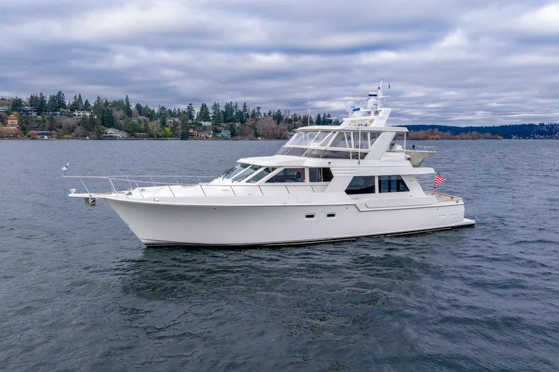 Slide: The Image of 1995 Tollycraft 57 Walk Around Pilothouse yacht on a scenic lake. - 6