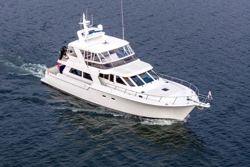 Slide: The Image of 1995 Tollycraft 57 Walk Around Pilothouse yacht cruising on open water. - 66