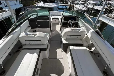 Slide: The Image of 2022 Regal LX6 boat interior with luxurious seating and modern dashboard. - 6