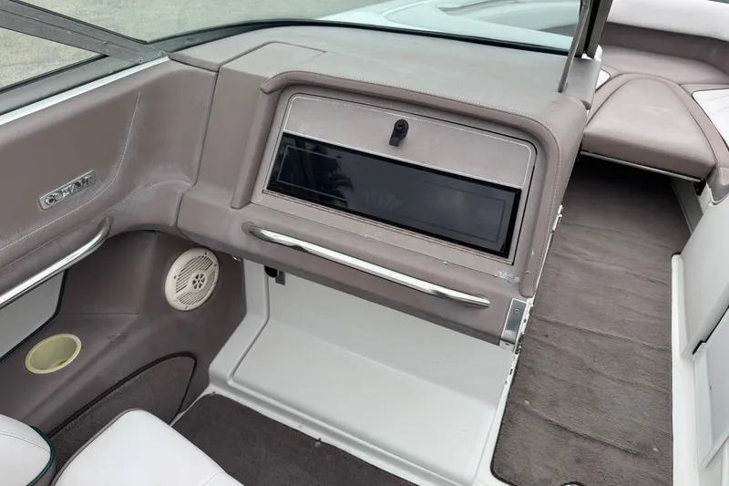 Slide: The Image of Interior of a 1994 Cobalt 252 boat, featuring dashboard and seating area. - 17