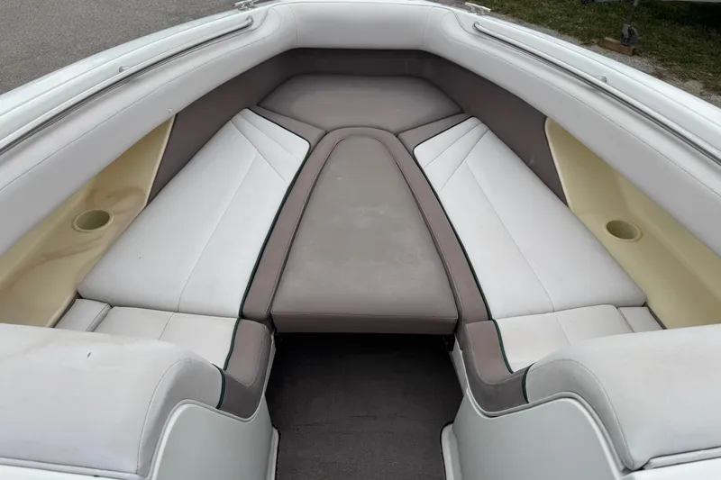 Slide: The Image of Interior seating of a 1994 Cobalt 252 boat, featuring white and beige upholstery. - 18