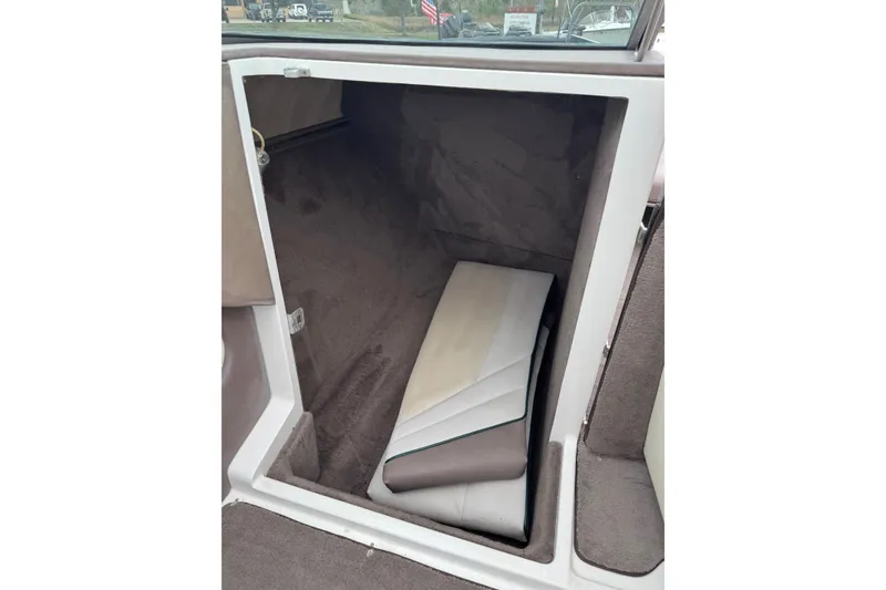 Slide: The Image of Interior cabin of a 1994 Cobalt 252 boat with folded cushions. - 21