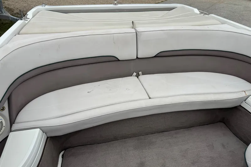 Slide: The Image of 1994 Cobalt 252 boat interior with white and gray seating. - 9