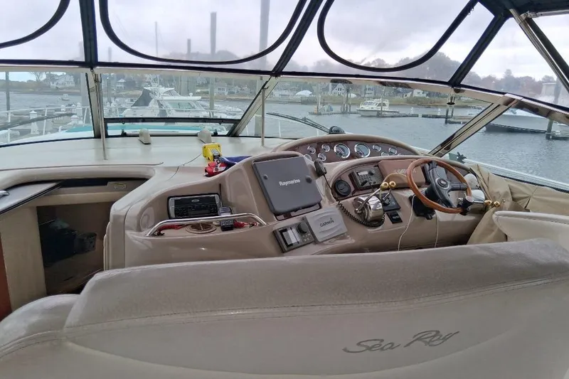 Slide: The Image of Interior view of 2000 Sea Ray 460 Sundancer yacht cockpit with navigation equipment. - 9