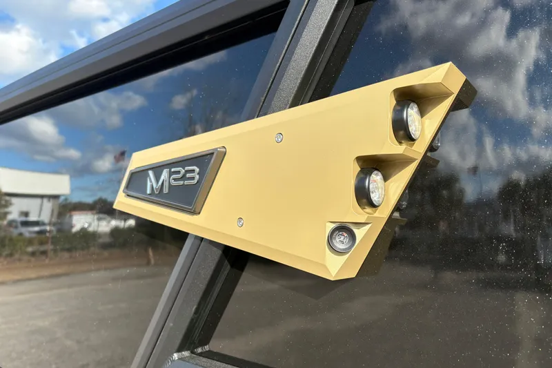 Slide: The Image of 2026 Alera M 23Q vehicle badge with modern design and lighting features. - 4