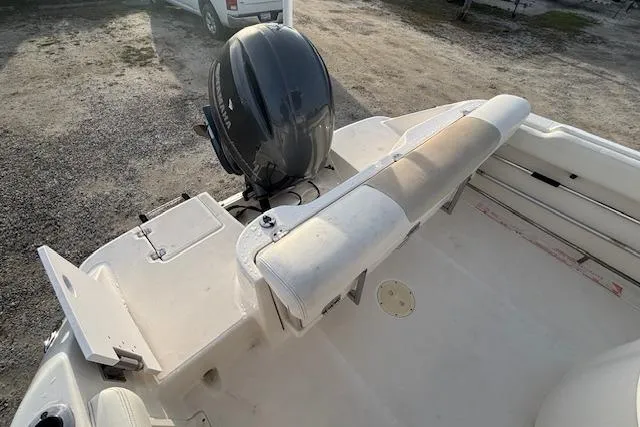 Slide: The Image of 2014 Robalo R222 Center Console boat with outboard motor and seating area. - 10