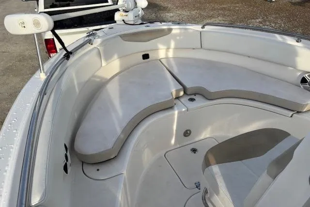 Slide: The Image of 2014 Robalo R222 Center Console boat interior with cushioned seating and storage. - 13
