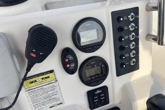 Slide: The Image of Control panel of 2014 Robalo R222 Center Console boat with gauges and switches. - 17