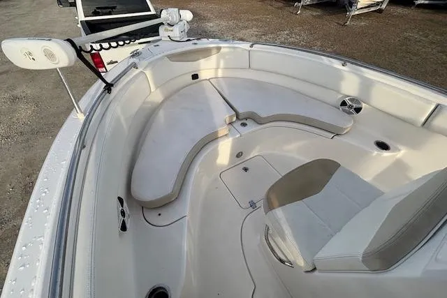 Slide: The Image of 2014 Robalo R222 Center Console boat interior with seating and storage compartments. - 18