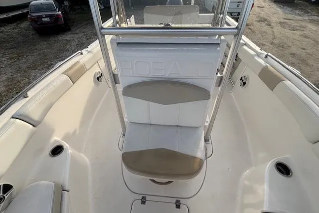 Slide: The Image of 2014 Robalo R222 Center Console boat interior with seating and console view. - 19
