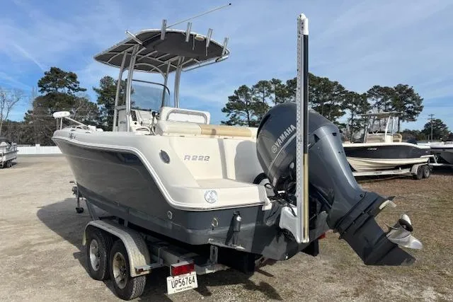 Slide: The Image of 2014 Robalo R222 Center Console boat with Yamaha outboard engine on trailer. - 2