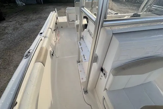 Slide: The Image of 2014 Robalo R222 Center Console boat interior with seating and console view. - 22