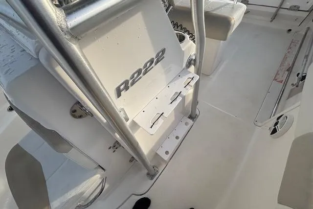 Slide: The Image of 2014 Robalo R222 Center Console boat interior with seating and console details. - 24